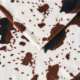 Edenleaf cow print blanket gift-ready packaging for loved ones.