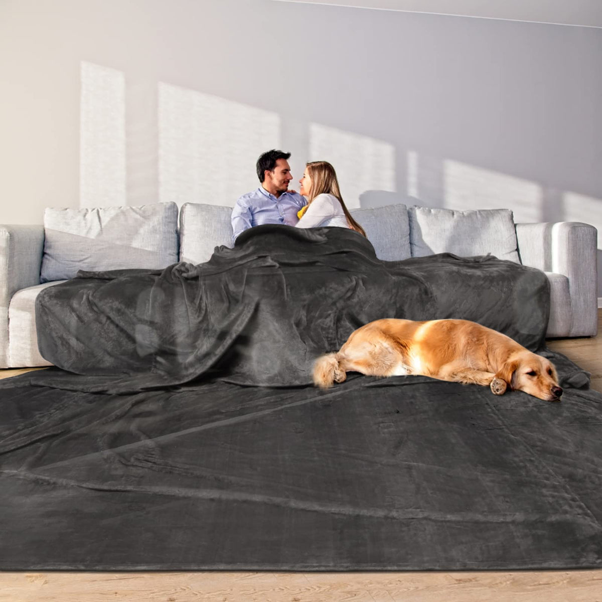 Edenleaf oversized blanket on bed and sofa for shared warmth.