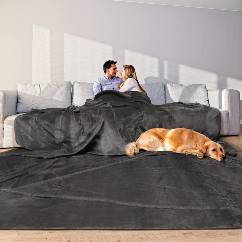 Edenleaf oversized blanket on bed and sofa for shared warmth.