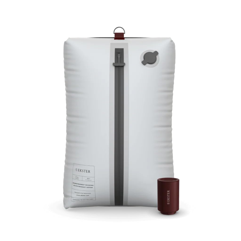 Ekster Travel Pack Vacuum Bags with pump demonstrate space-saving capacity for packed travel outfits.