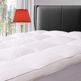 ELEMUSE king-size topper close-up of down layer showing plush loft and breathability.