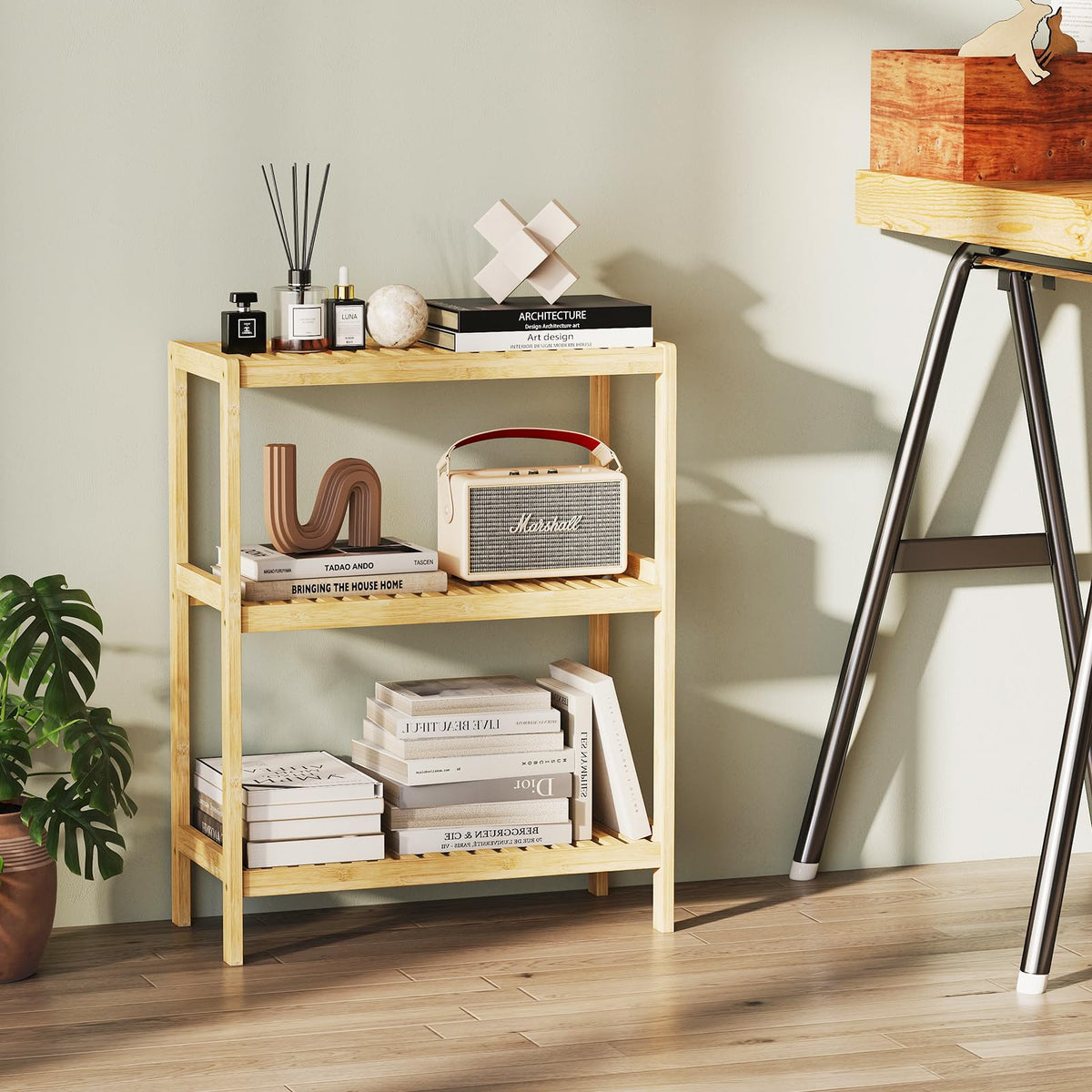 Elepude Bamboo Shelf plant stand with decorative greenery.