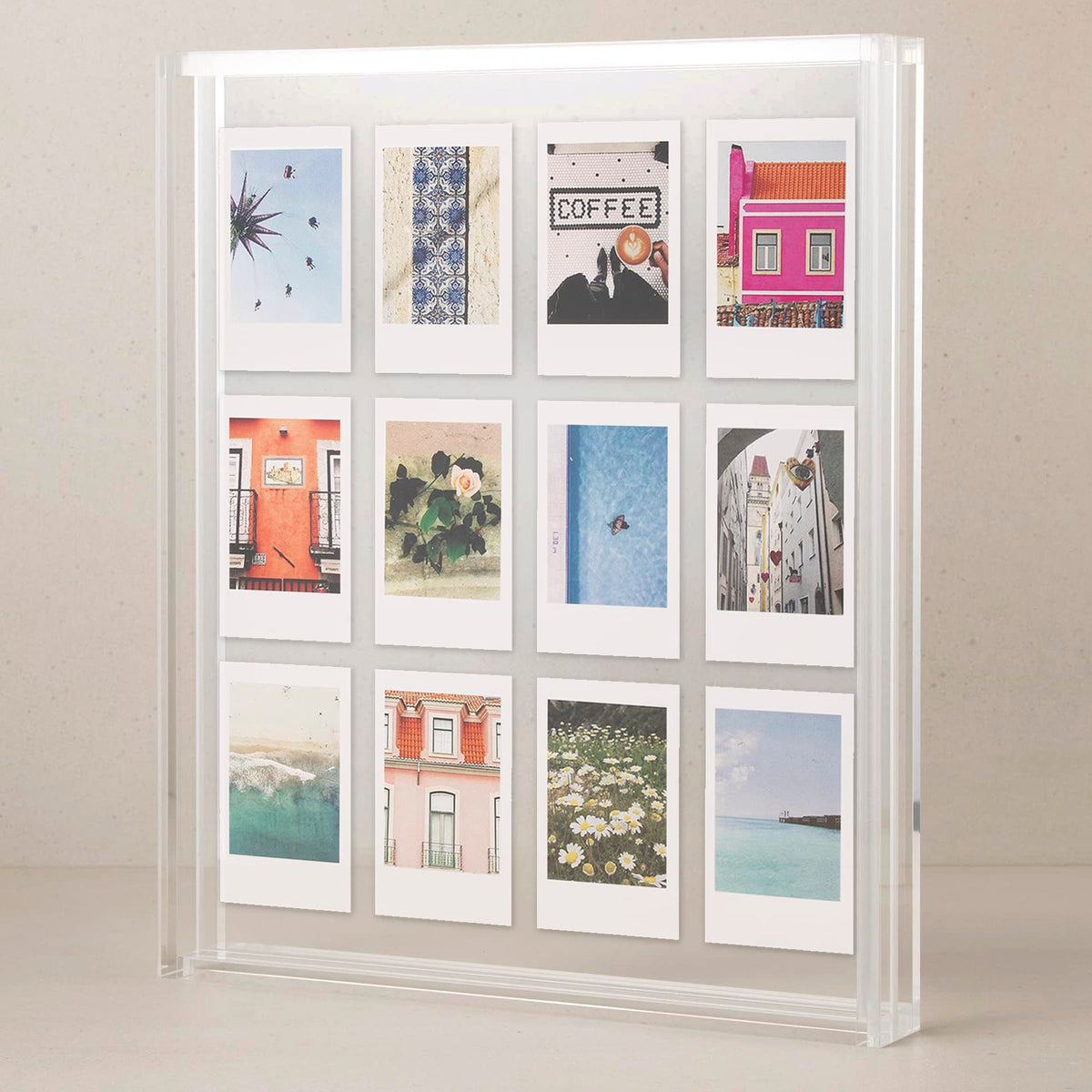Elil clear acrylic floating frame highlights an 8x10 photo in a sleek display.