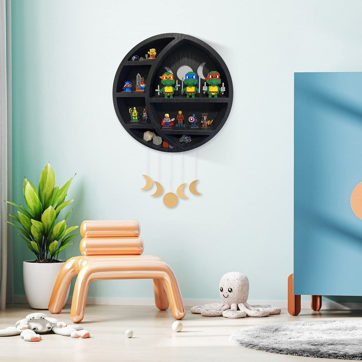 Black round shelf blending modern and celestial styles in any room.