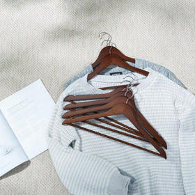 ELONG HOME hanger showing ergonomic shoulder design to help maintain garment shape.