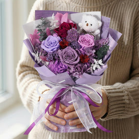 Emibele bouquet on a living room table enhances the space with lasting charm.