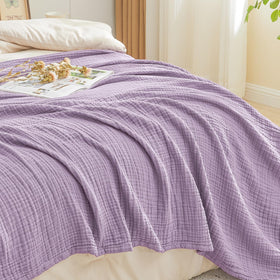 EMME lightweight blanket ideal for travel and couch lounging.
