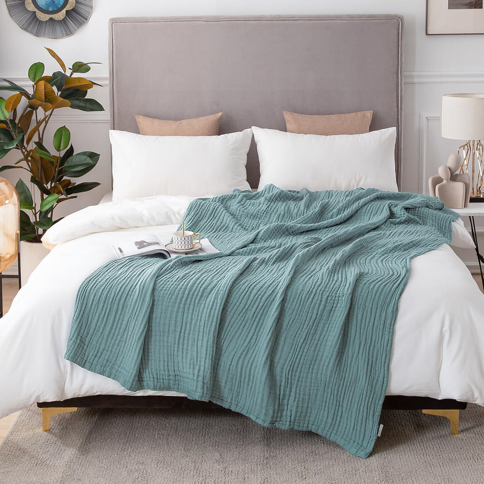 EMME cotton blanket flatlay shows soft, breathable fabric for all-season comfort