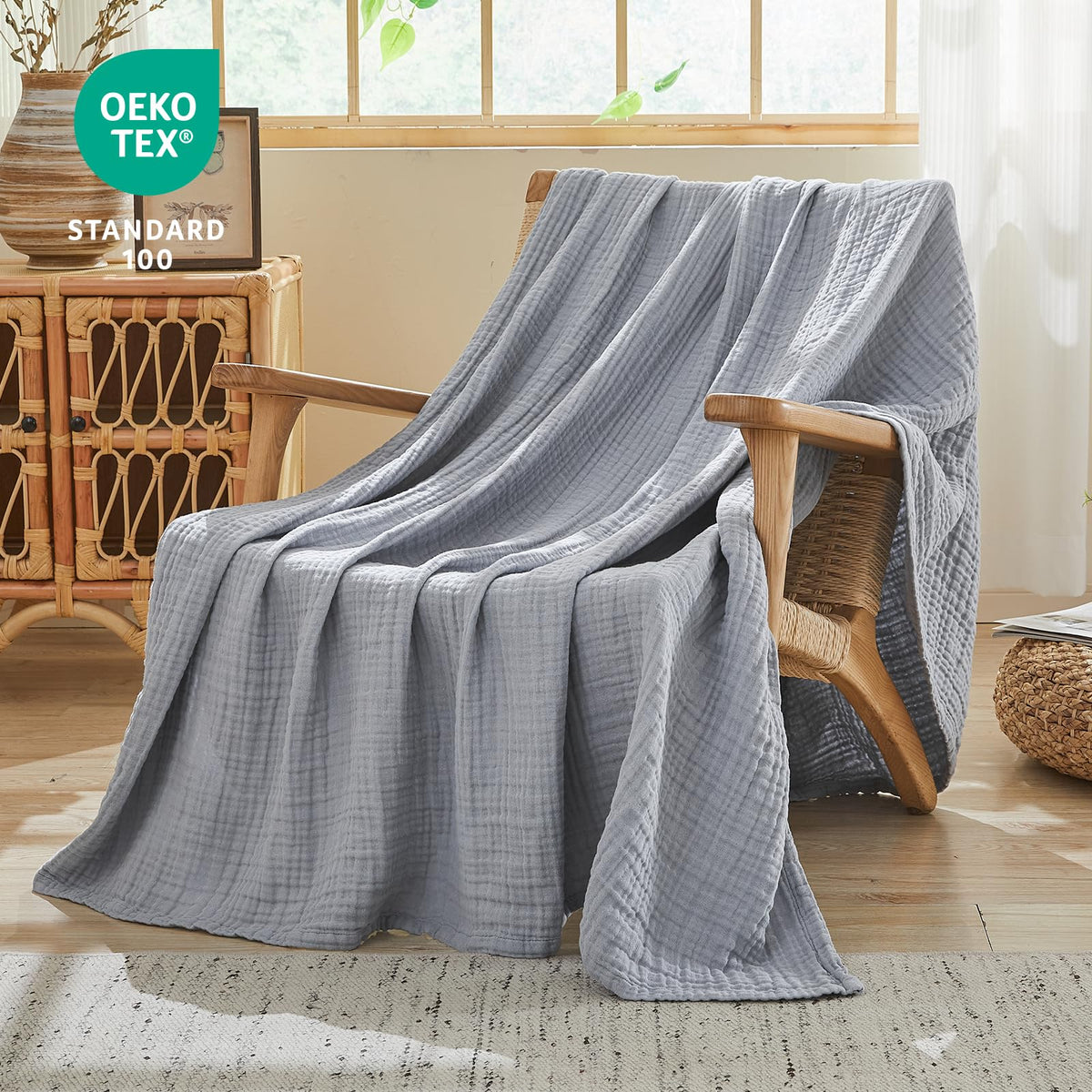 EMME blanket on a bed shows breathable four-layer muslin fabric
