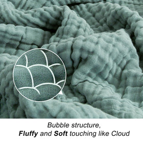 EMME blanket texture close-up shows soft gauze weave.