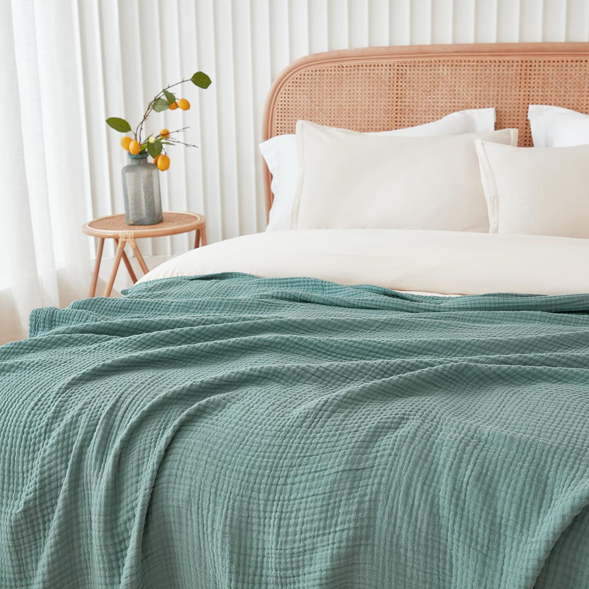 EMME blanket on bed layering demonstrates oversized king coverage for shared warmth