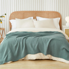 EMME cotton muslin king blanket texture closeup shows breathable, skin-friendly gauze