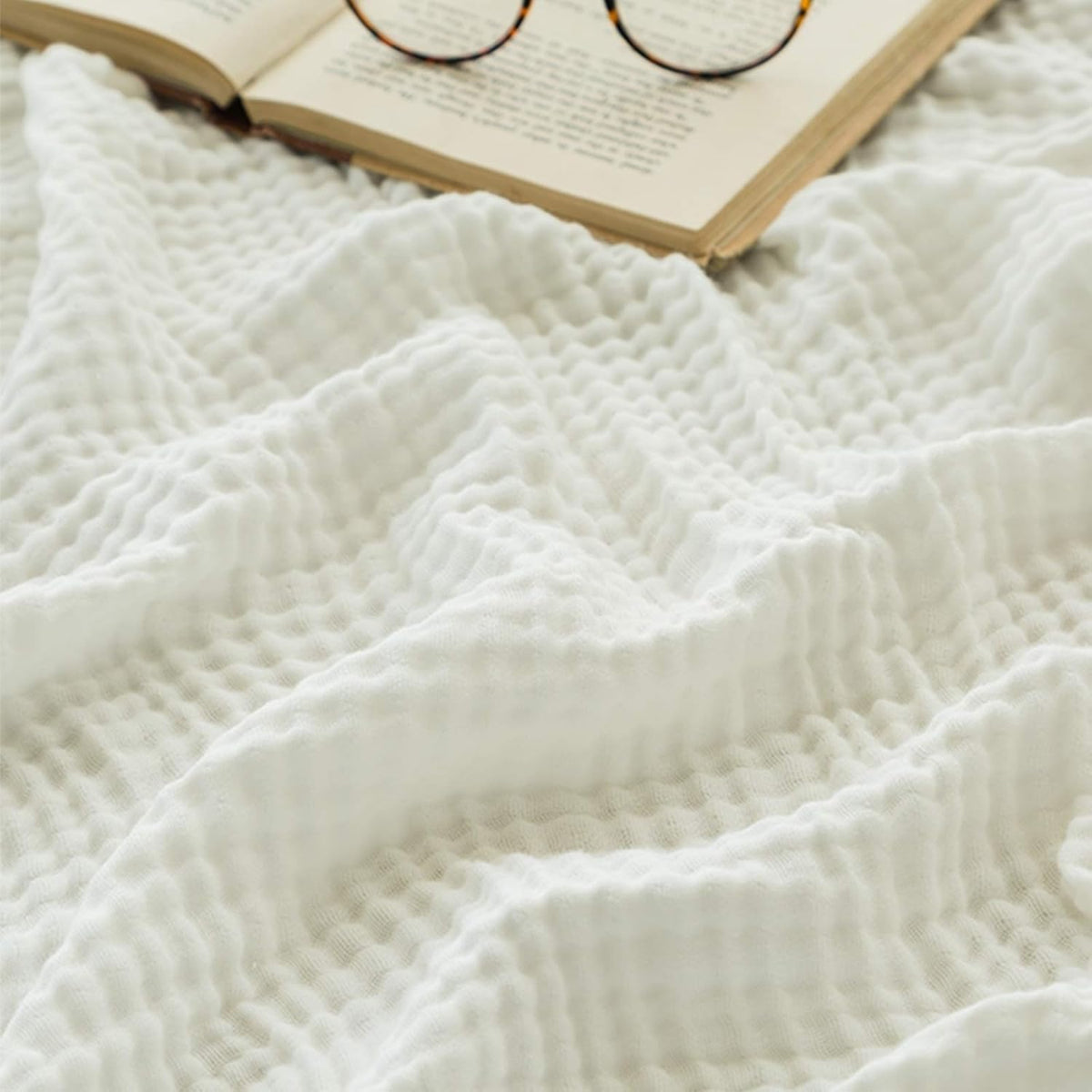 EMME cotton muslin large throw blanket flatlay showing soft, breathable fabric
