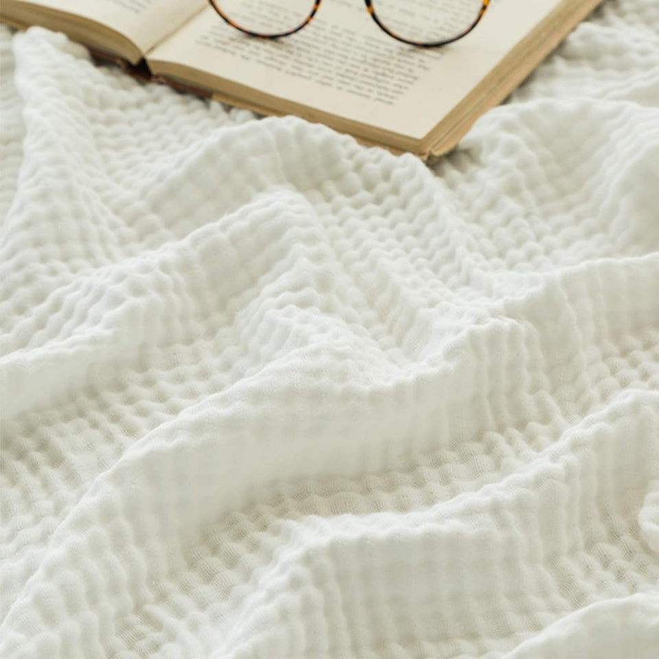 EMME cotton muslin large throw blanket flatlay showing soft, breathable fabric
