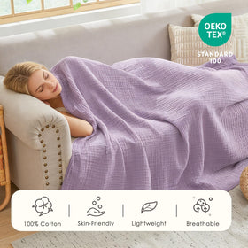 EMME bed blanket draped over bed for breathable, year-round warmth.