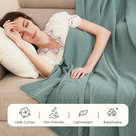 EMME cotton throw blanket on bed for a nap, inviting warmth and comfort.