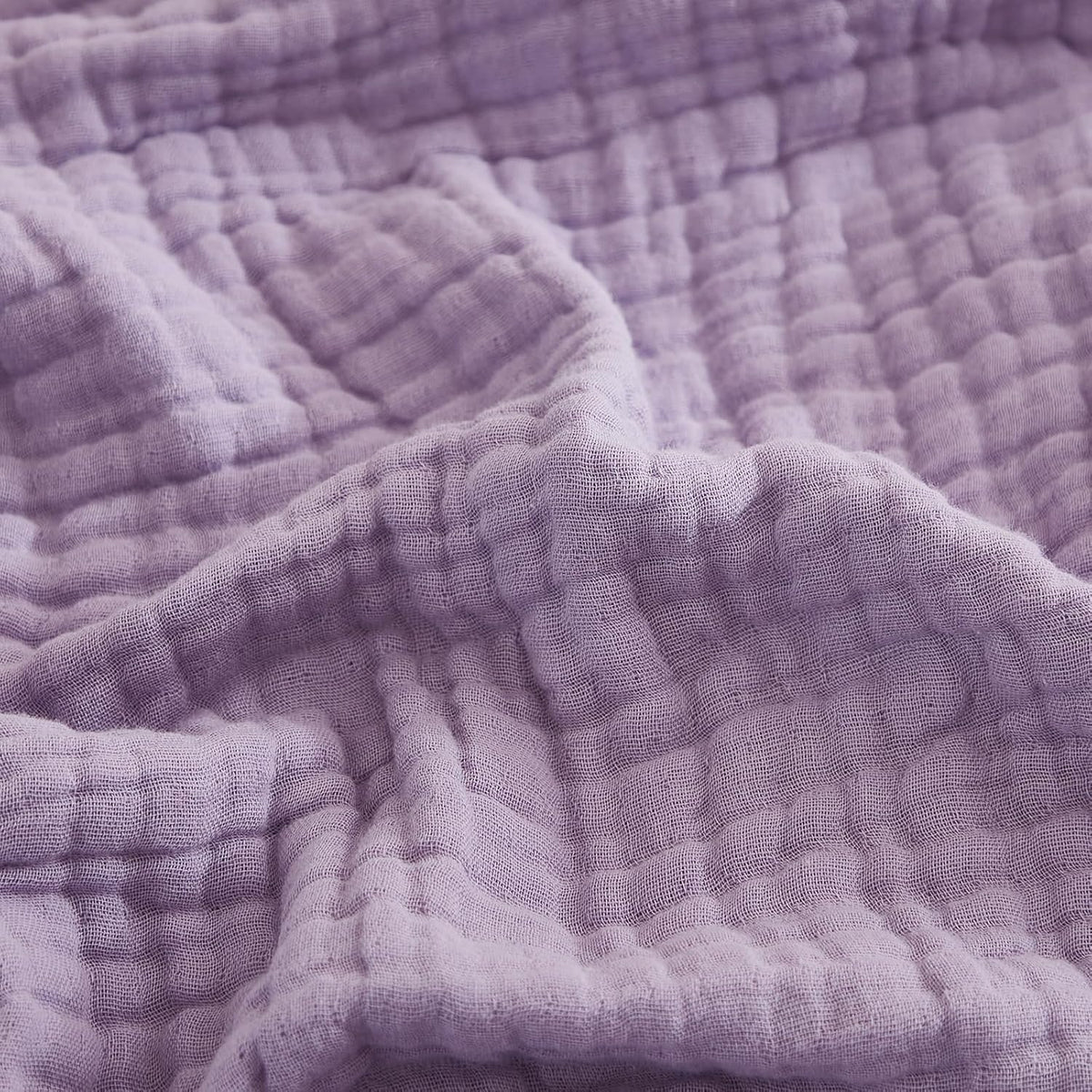 EMME cotton throw blanket with soft texture for cozy comfort.