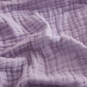 EMME cotton throw blanket with soft texture for cozy comfort.