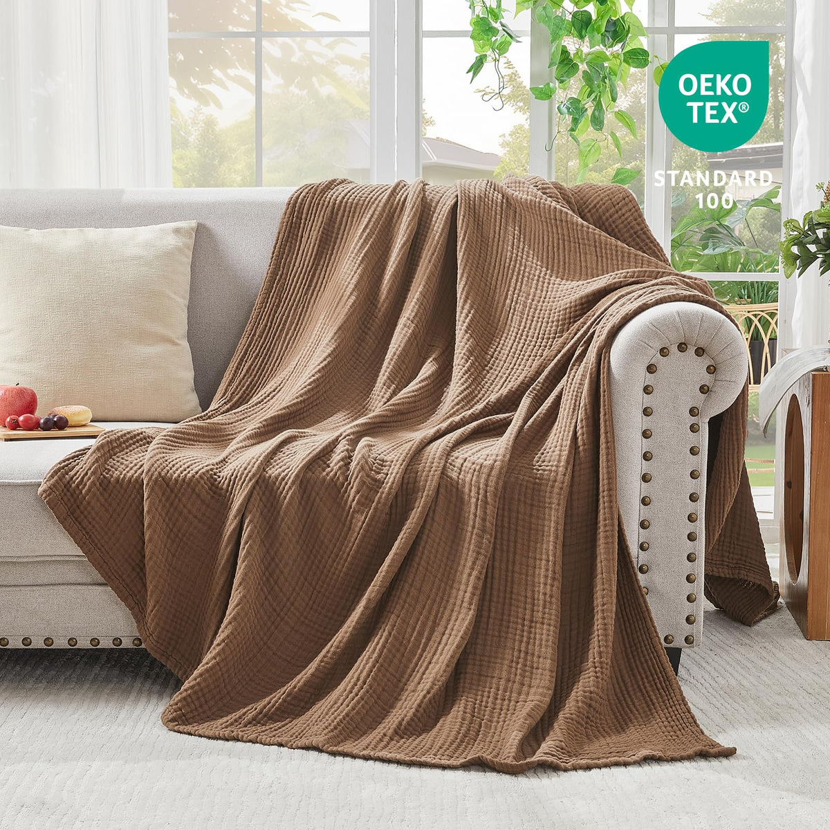 EMME couch with blanket draped to highlight versatility