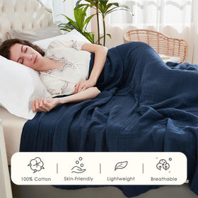 EMME muslin queen blanket folded, ready for versatile bed or sofa use.