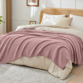 Folded EMME muslin throw showing 50x70 size.