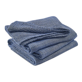 EMME Heather Navy blanket adds calm color to any room.