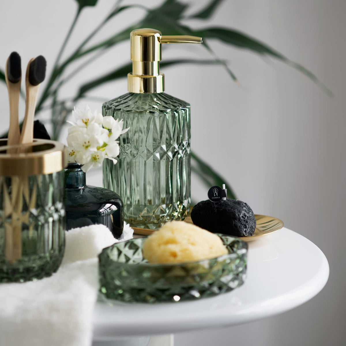 EMPO green glass toothbrush holder with stainless steel top in humid bathroom