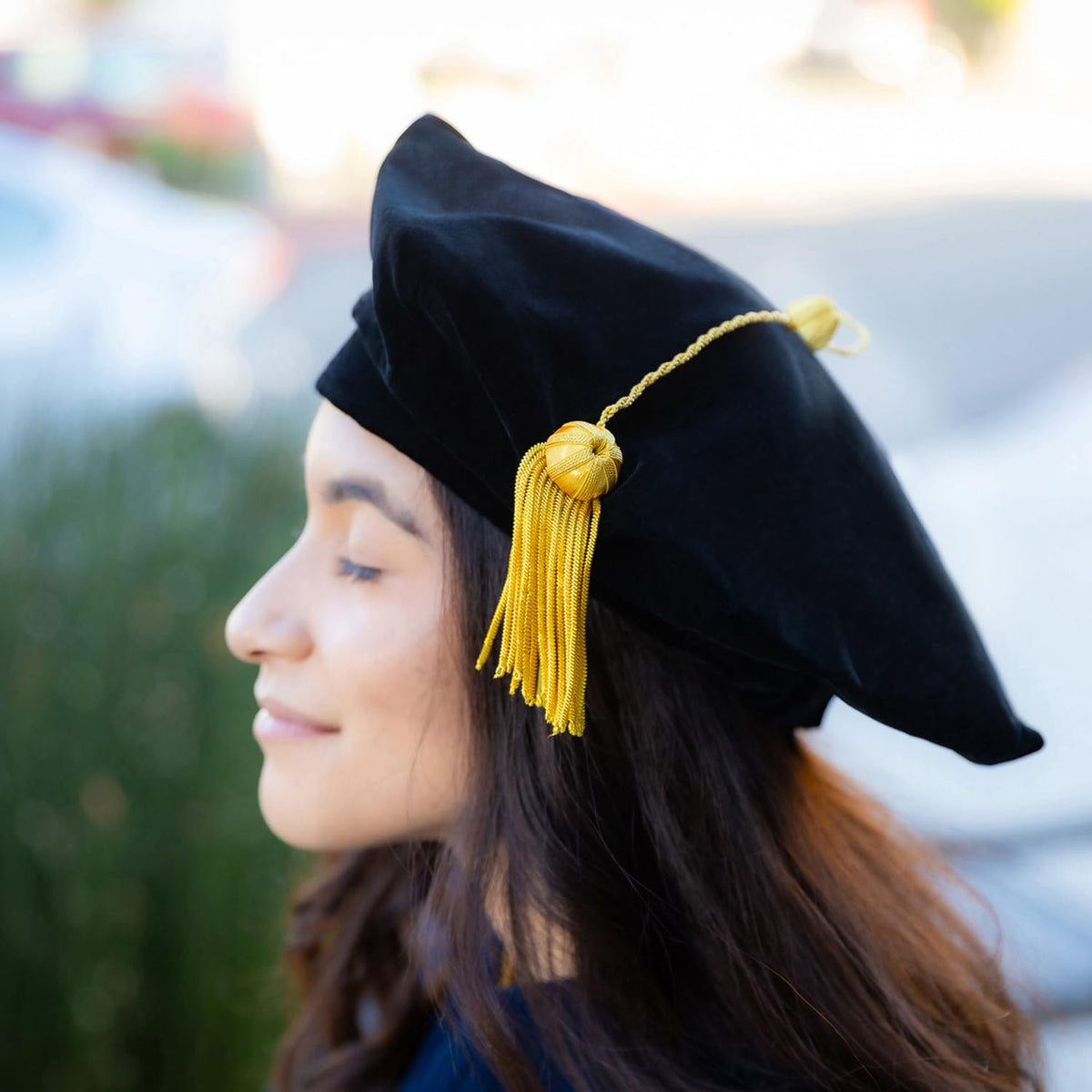 Endea Graduation ceremony setting shows dignified presence beside diploma