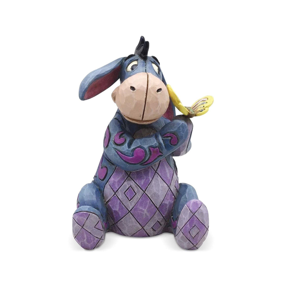 Enesco Disney Traditions Jim Shore Eeyore butterfly figurine with cheerful color display.