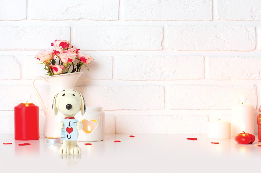 Enesco Peanuts Jim Shore Snoopy statue suitable for desk decor.