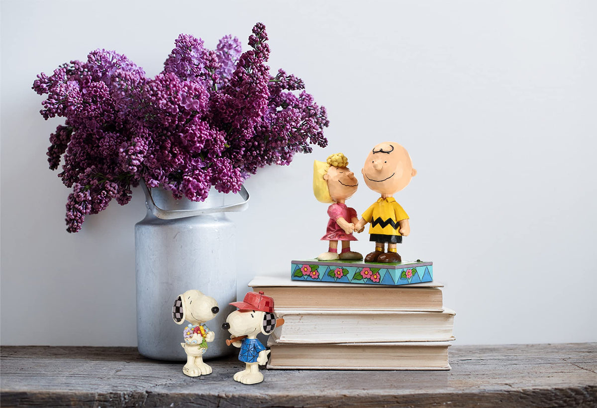 Enesco Snoopy holding flowers, side view showing folk-art design for display