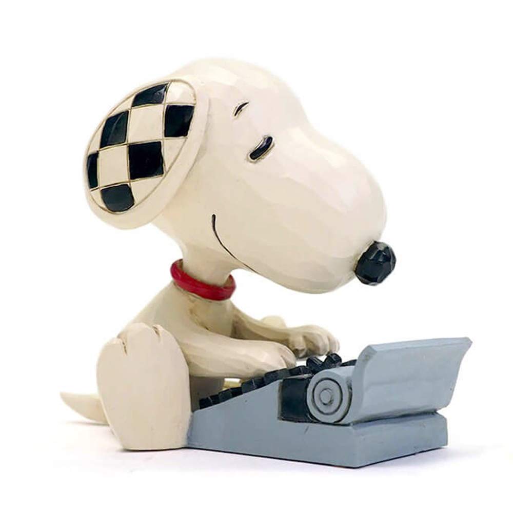 Snoopy typing pose on a classic typewriter adds storytelling whimsy.