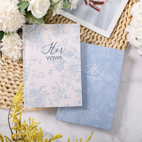 Close-up of blue floral cover detail on Engrowtic vow books.