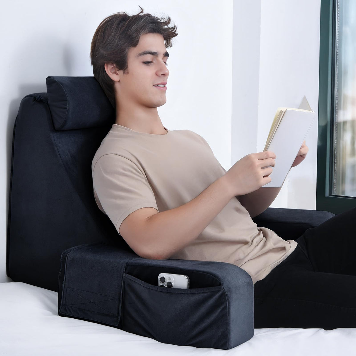 ENITYA Reading Pillow with 45-degree backrest supports neck and spine during reading.