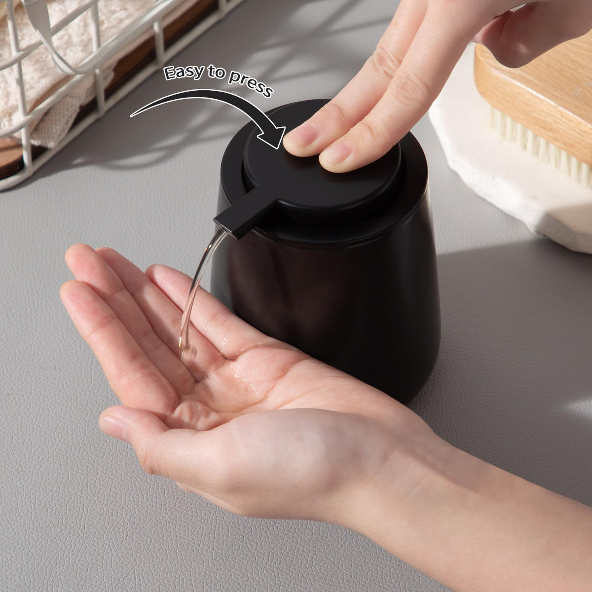 Enra removable pump doubles as cup holder when detached