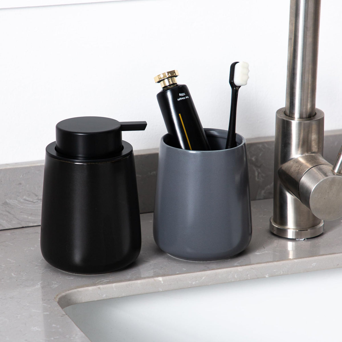 Enra black dispenser with sleek matte finish complements contemporary decor