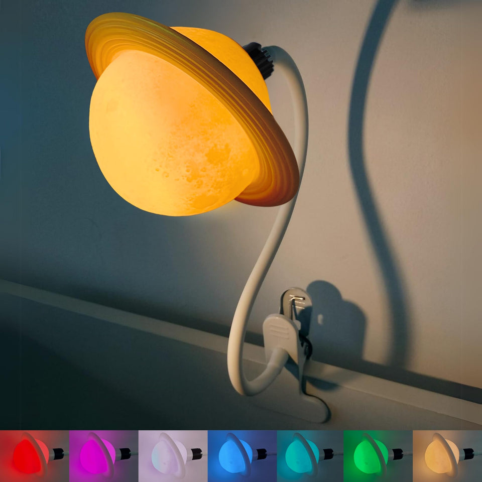 Ergojojo Saturn clip-on lamp attached to a bed post for bedside reading.