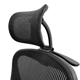 ERGOKING headrest attachment on Aeron chair enhances neck support during long work sessions.