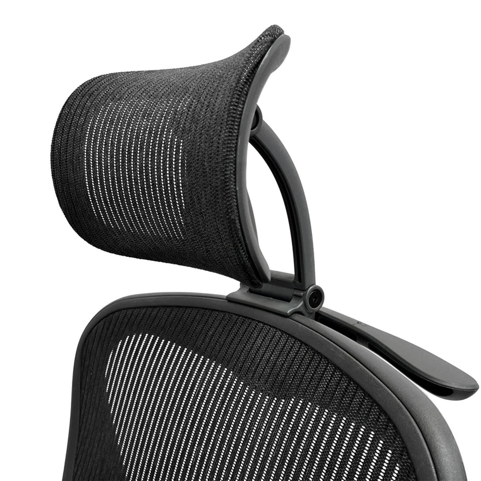 ERGOKING headrest attachment on Aeron chair enhances neck support during long work sessions.