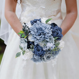 Erhalings dusty blue wedding table decor arranged as a centerpiece.