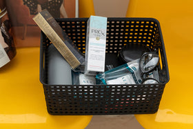 Eslite plastic storage basket organization on shelves for small parts.