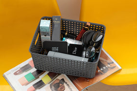 Vanity storage using Eslite baskets for cosmetics and grooming tools