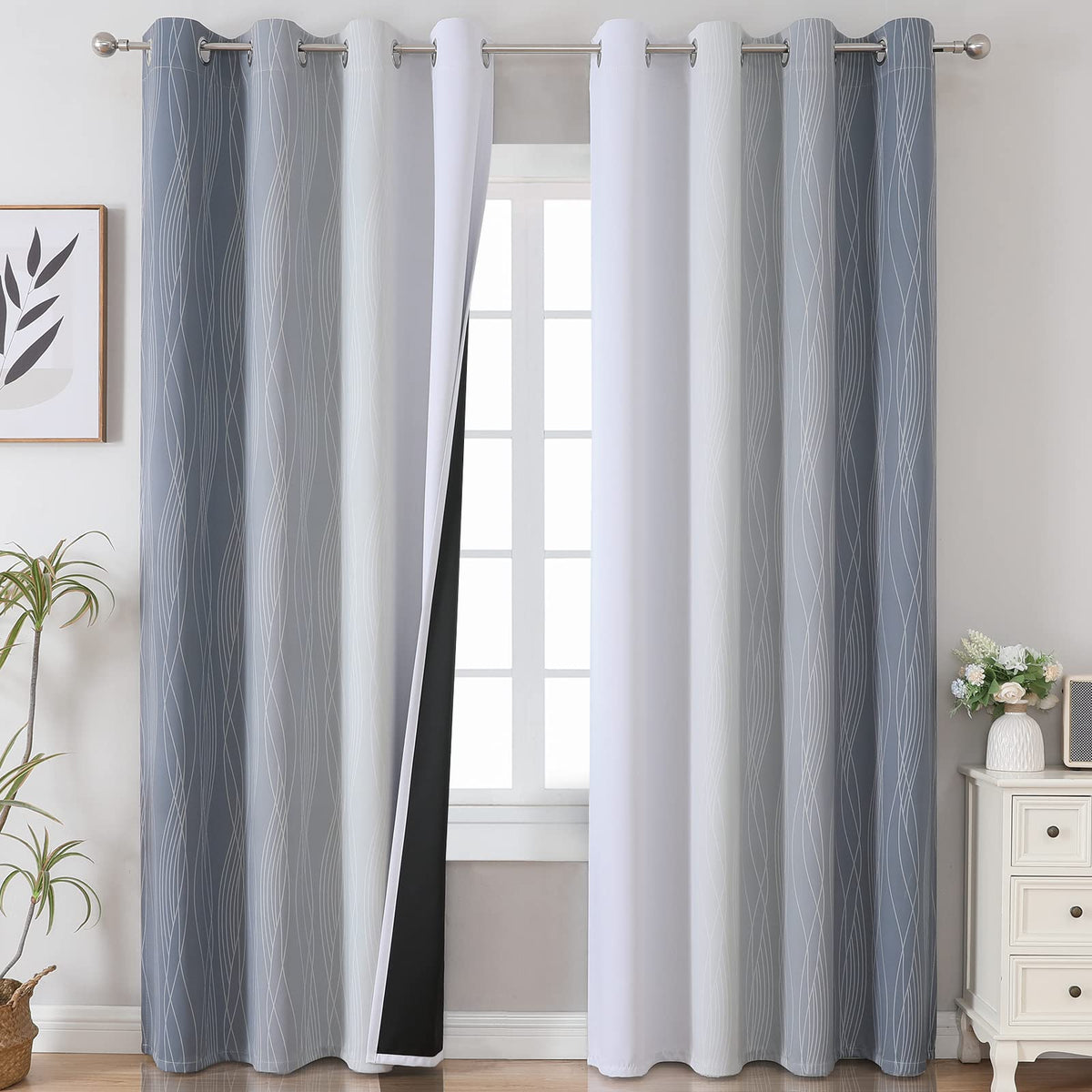 estelar textiler grey ombre blackout curtains in a living room setting with soft gradient drape