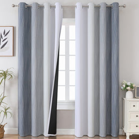 estelar textiler grey ombre blackout curtains in a living room setting with soft gradient drape