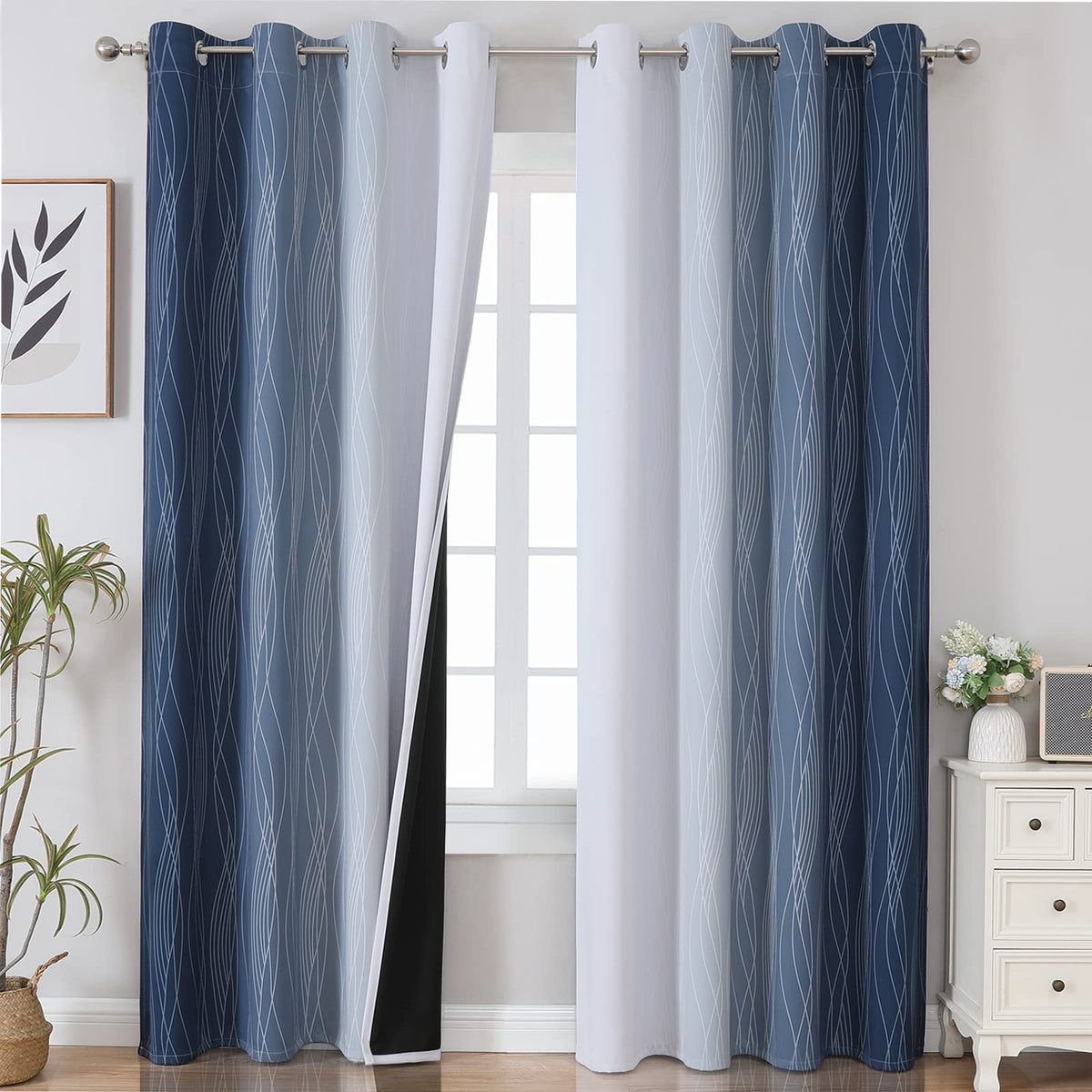 Estelar Textiler Ombre curtains in greyish-white and navy block light for privacy.