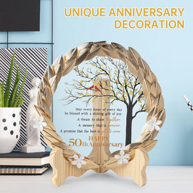 EVA murmure gilded metal wreath surrounds a crystal plaque for timeless display