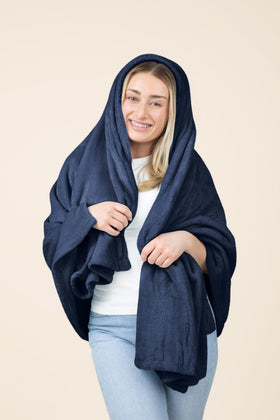 Compact rolled EverSnug travel blanket ready for carry-on