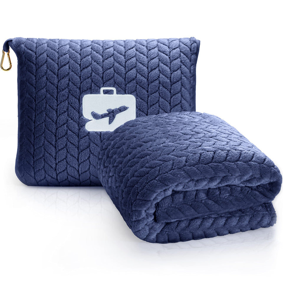 EverSnug navy travel blanket draped over plane seat for warmth and comfort