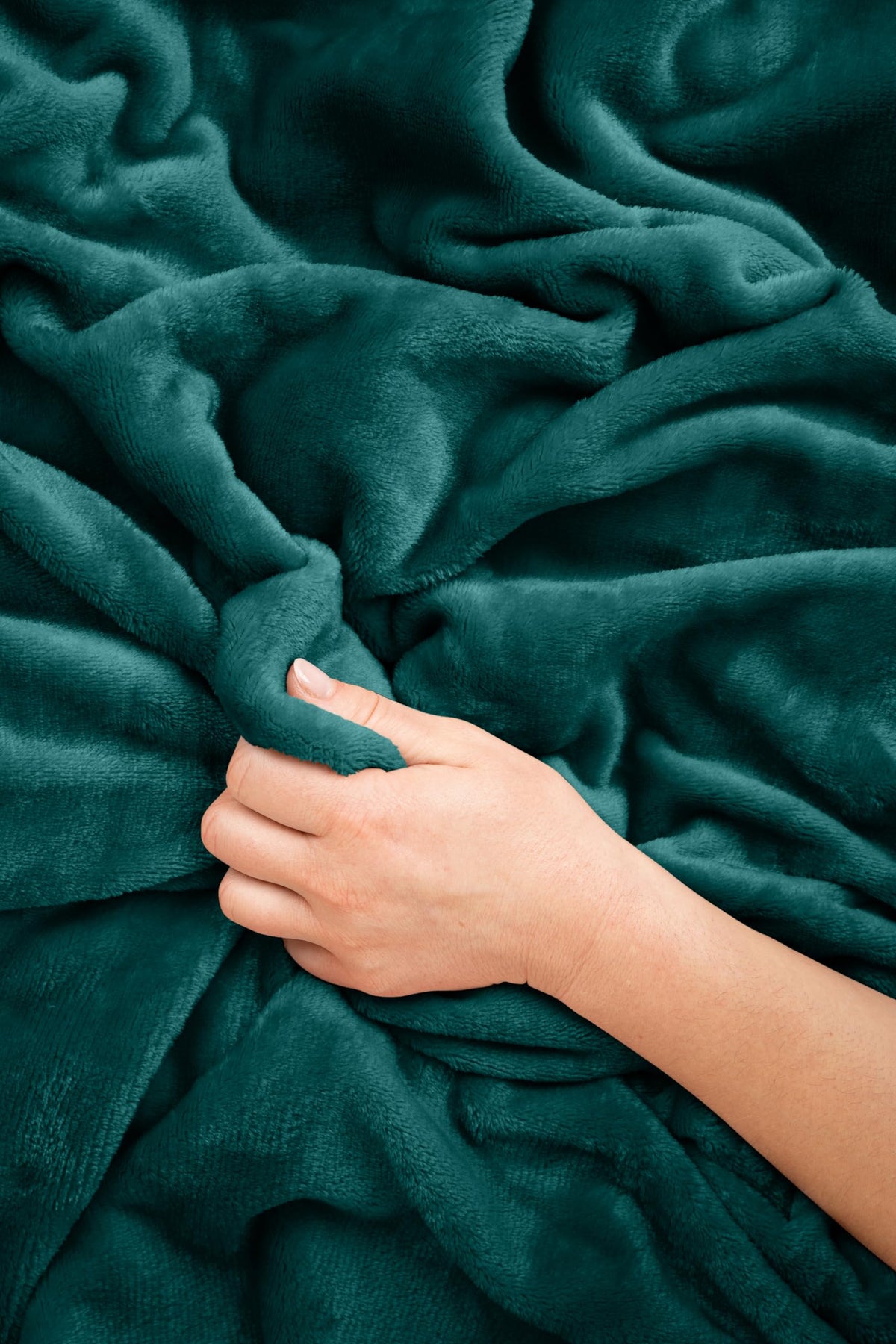 EverSnug travel blanket teal used in camping for chilly evenings