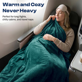 EverSnug travel blanket teal tucked into luggage sleeve for quick access